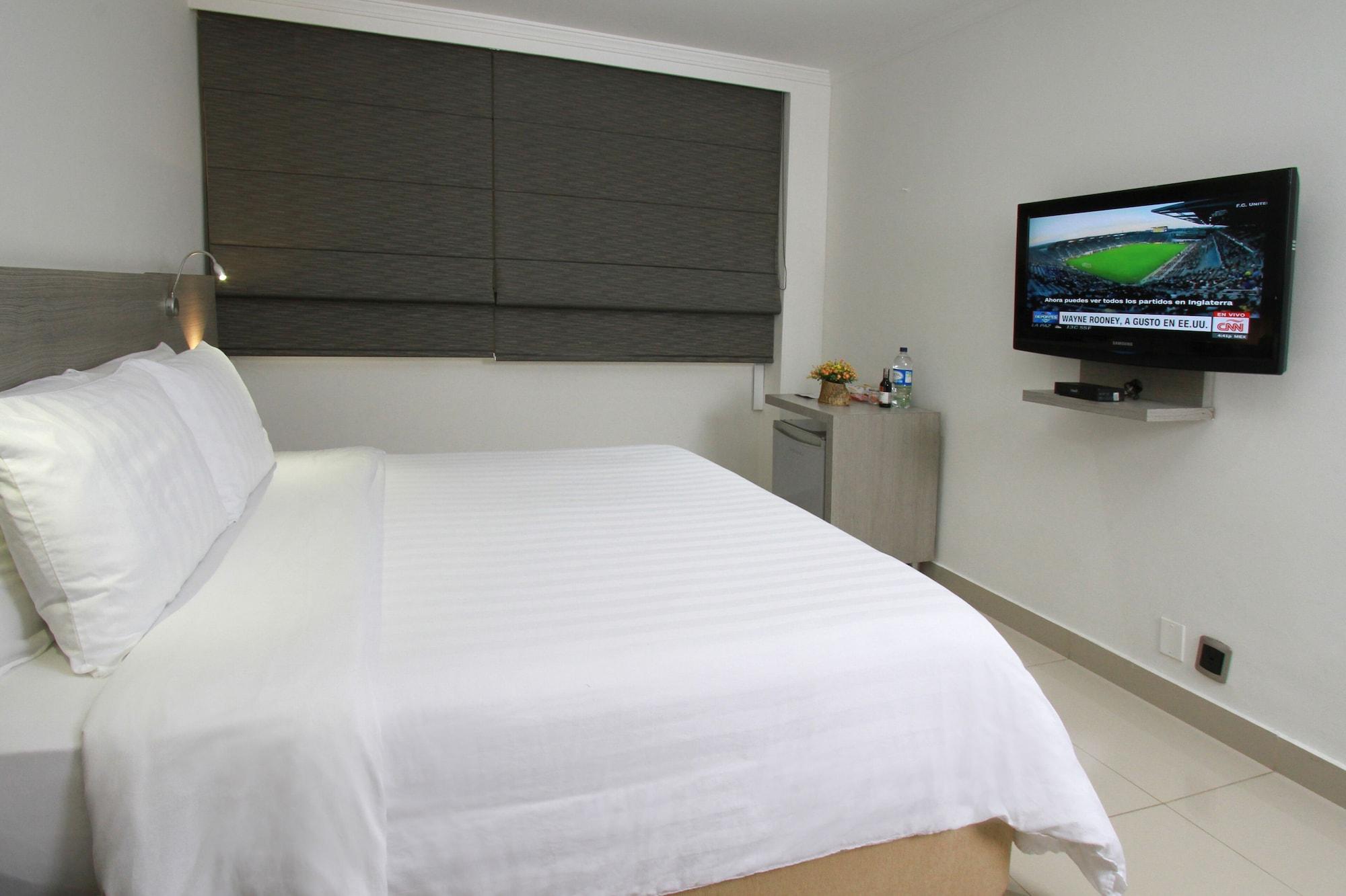 Hotel Barranquilla Plaza Bagian luar foto A bedroom at the hotel