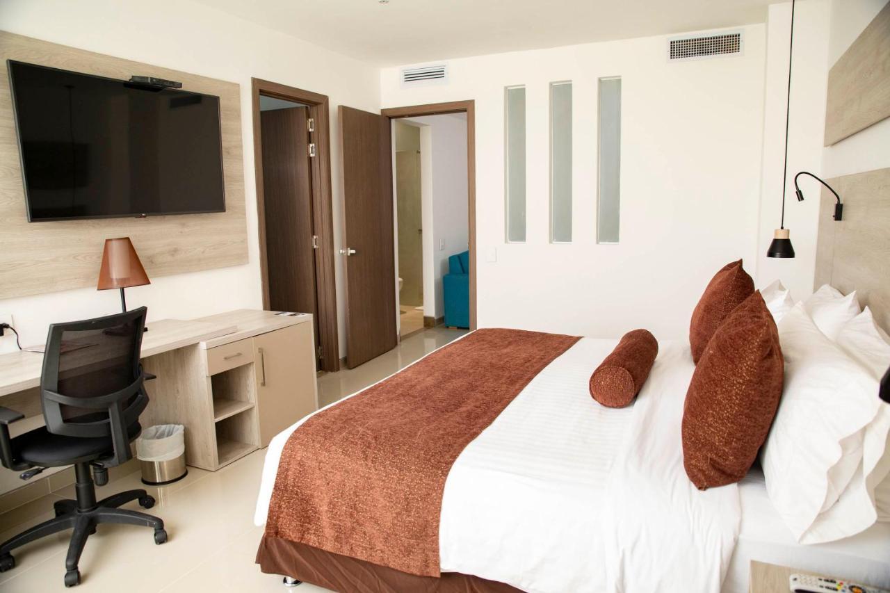 Hotel Barranquilla Plaza Bagian luar foto A room at the hotel